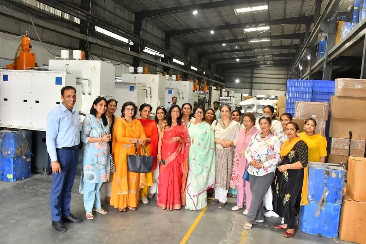 A visiting group with plant leadership on the shop floor